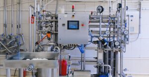 Detailed view of complex industrial machinery in a modern factory environment.